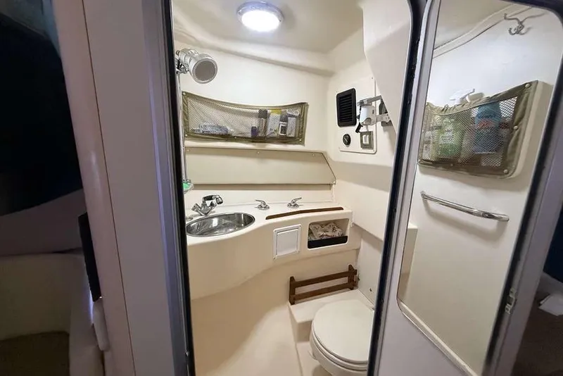 Slide: The Image of 2007 Grady-White Express 305 interior with DeWalt power inverter and monitor setup. - 25