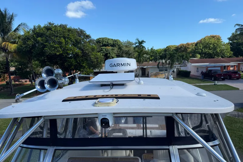 Slide: The Image of 2007 Grady-White Express 305 boat with Garmin radar, parked in a residential area. - 28