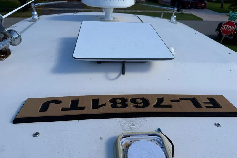 Slide: The Image of Security camera on 2007 Grady-White Express 305 boat, clear sky background. - 30