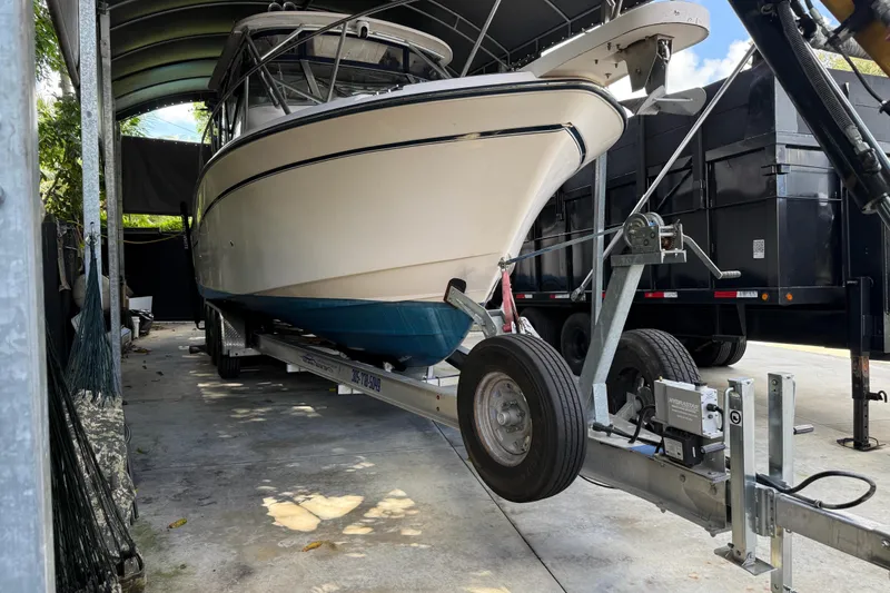 Slide: The Image of 2007 Grady-White Express 305 boat on trailer under shelter, side view. - 34