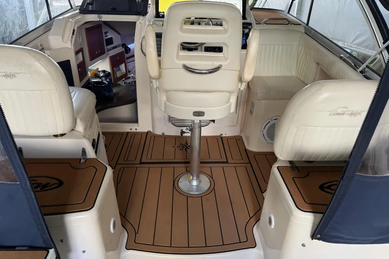 Slide: The Image of 2007 Grady-White Express 305 boat with dual outboard engines and cushioned seating. - 4