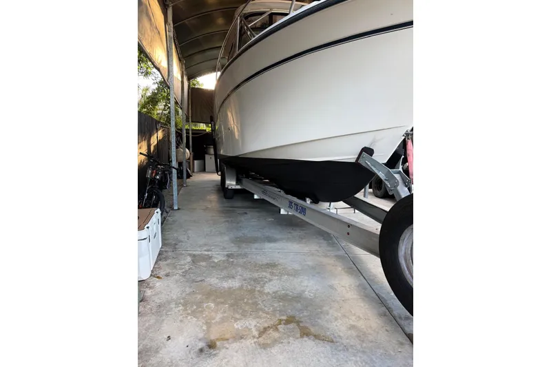 Slide: The Image of 2007 Grady-White Express 305 boat on trailer in covered storage. - 40