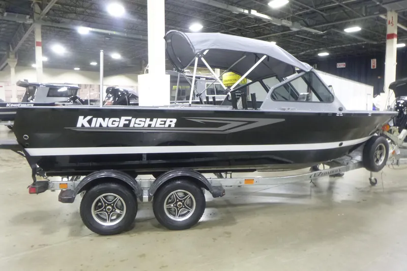 Slide: The Image of 2026 KingFisher 2025 Falcon boat on trailer in indoor showroom. - 12