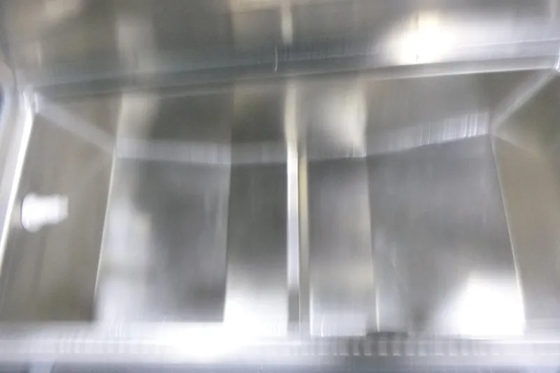 Slide: The Image of Blurred interior of a KingFisher 2025 Falcon boat, showcasing metallic surfaces. - 17