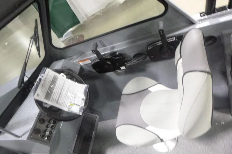 Slide: The Image of Interior of 2026 KingFisher 2025 Falcon boat with steering wheel and seat. - 19