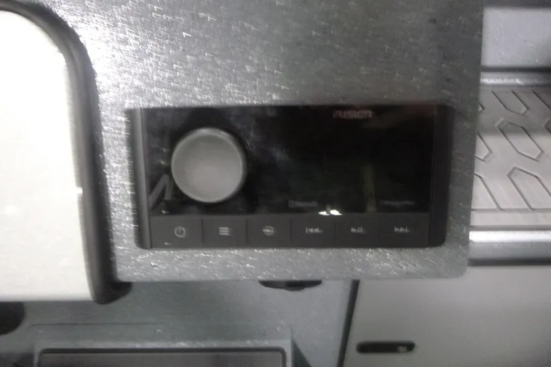 Slide: The Image of Control panel of KingFisher 2025 Falcon, featuring a Fusion audio system. - 22