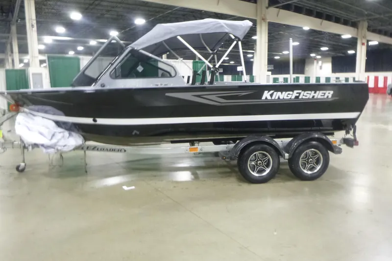 The Image of KingFisher 2025 Falcon boat on trailer in indoor showroom, 2026 model. - 9