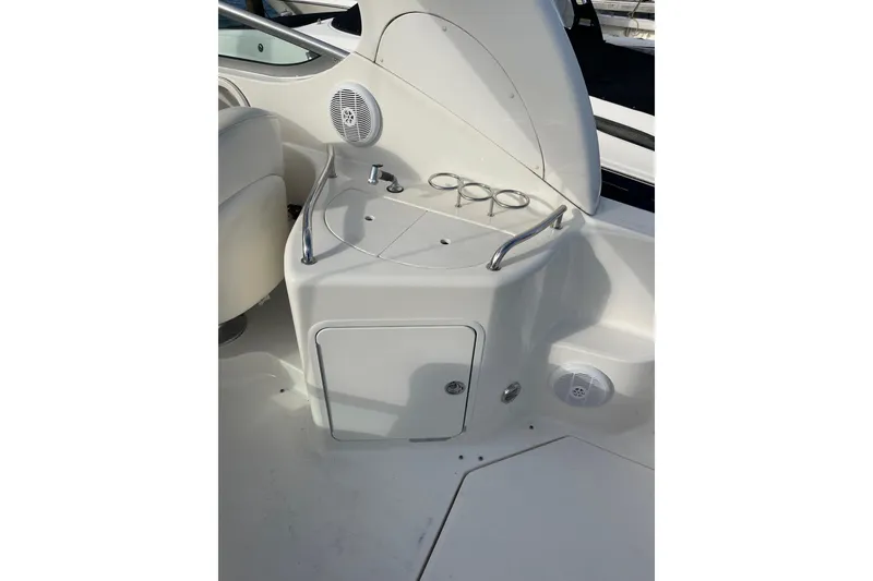 Slide: The Image of 2003 Sea Ray 280 Sundancer boat interior with sink and cup holders. - 8