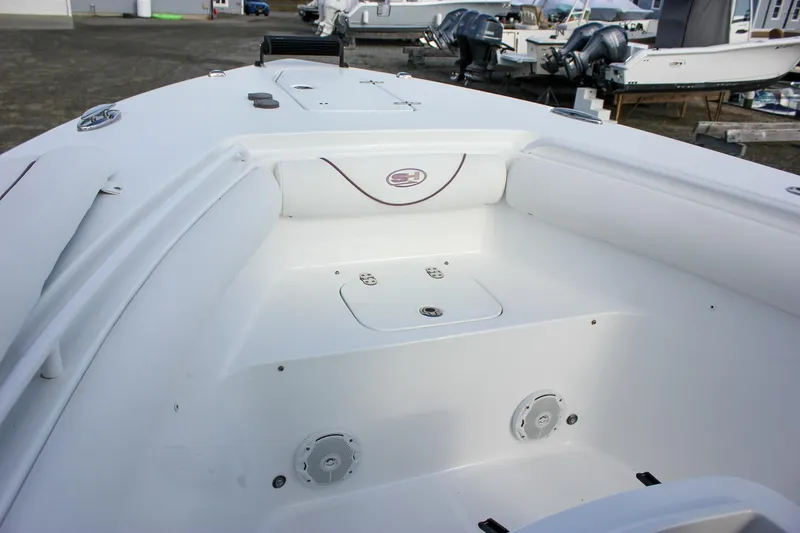 Slide: The Image of 2018 Sea Hunt Gamefish 30 boat interior with storage compartments and speakers. - 12