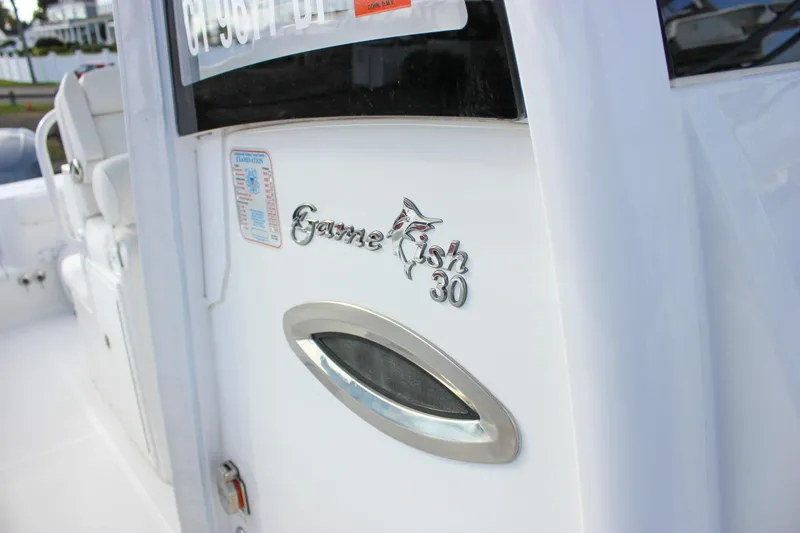 Slide: The Image of 2018 Sea Hunt Gamefish 30 boat, close-up of logo and design details. - 16