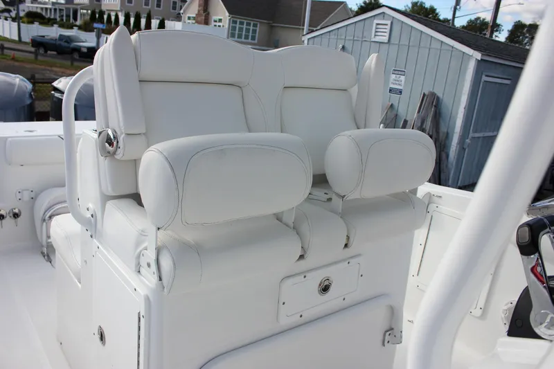 Slide: The Image of 2018 Sea Hunt Gamefish 30 boat with white cushioned seating. - 24