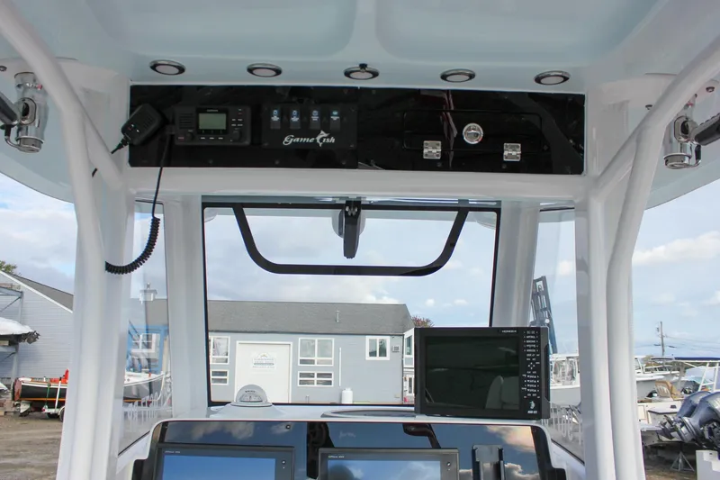 Slide: The Image of 2018 Sea Hunt Gamefish 30 boat dashboard with navigation equipment and controls. - 28
