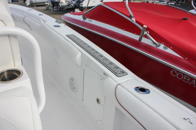 Slide: The Image of 2018 Sea Hunt Gamefish 30 interior with measuring ruler and cup holder. - 31