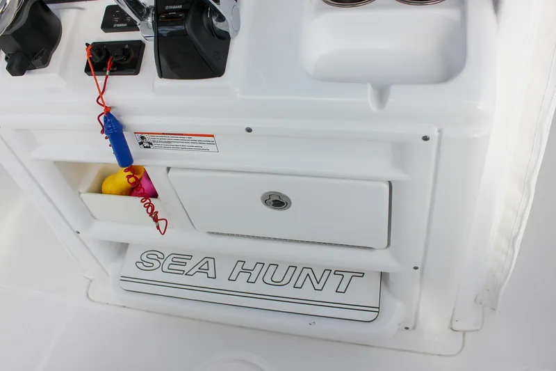 Slide: The Image of 2018 Sea Hunt Gamefish 30 console with controls and storage compartments. - 34