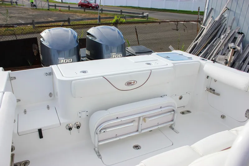 Slide: The Image of 2018 Sea Hunt Gamefish 30 boat with dual Yamaha 300 engines, white interior. - 36