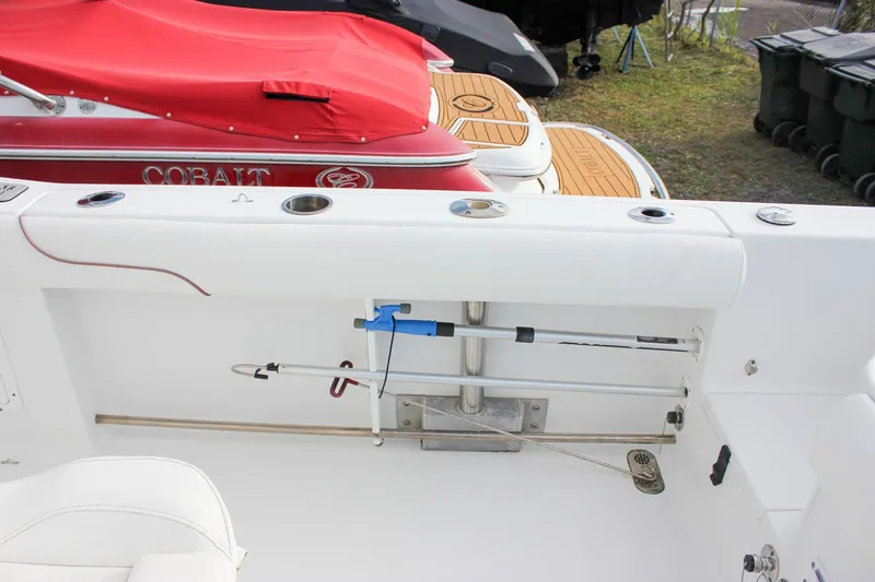 Slide: The Image of 2018 Sea Hunt Gamefish 30 boat interior with rod holders and seating. - 37