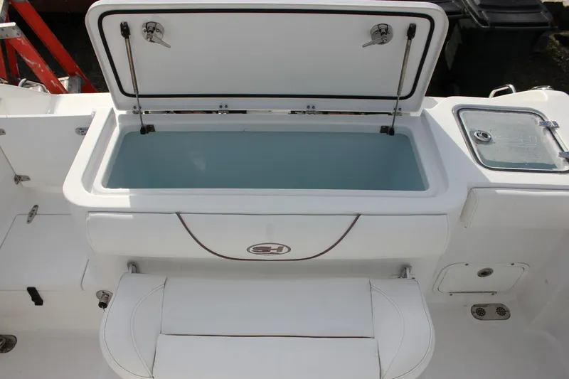 Slide: The Image of 2018 Sea Hunt Gamefish 30 boat with open storage compartment and seating. - 43