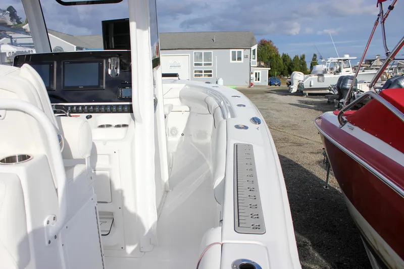Slide: The Image of 2018 Sea Hunt Gamefish 30 boat interior with modern dashboard and seating. - 49
