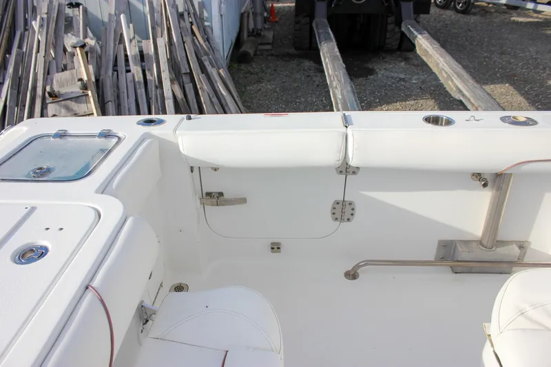 Slide: The Image of 2018 Sea Hunt Gamefish 30 boat interior with seating and storage compartments. - 58