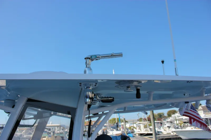 Slide: The Image of 2018 Sea Hunt Gamefish 30 boat with T-top and fishing rod holder. - 6