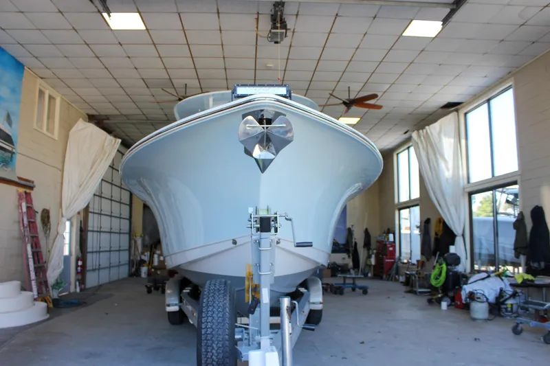 Slide: The Image of 2018 Sea Hunt Gamefish 30 boat in a garage, front view. - 61