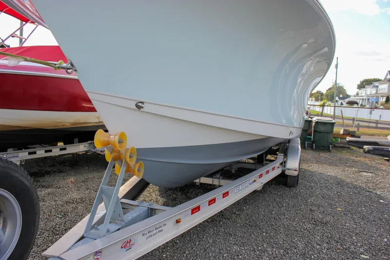 Slide: The Image of 2018 Sea Hunt Gamefish 30 boat on trailer, parked outdoors. - 9