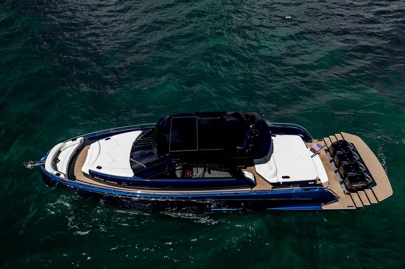 Slide: The Image of Luxury yacht steps on Dutch American DA 53, 2025 model, with sleek blue design. - 10