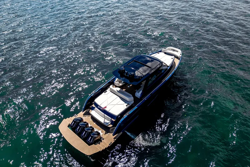 Slide: The Image of Luxurious Dutch American DA 53 yacht interior with plush seating, 2025 model, under a cloudy sky. - 12