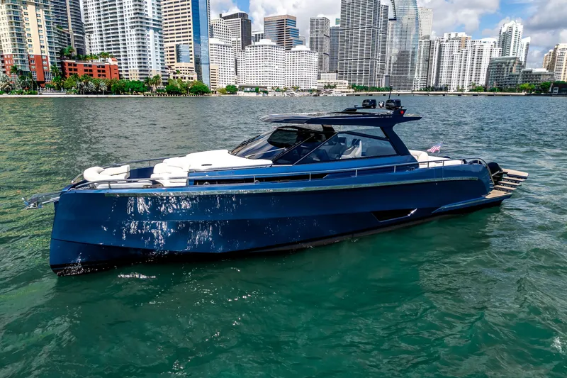 Slide: The Image of Luxury Dutch American DA 53 yacht cruising on a serene lake, 2025 model. - 2