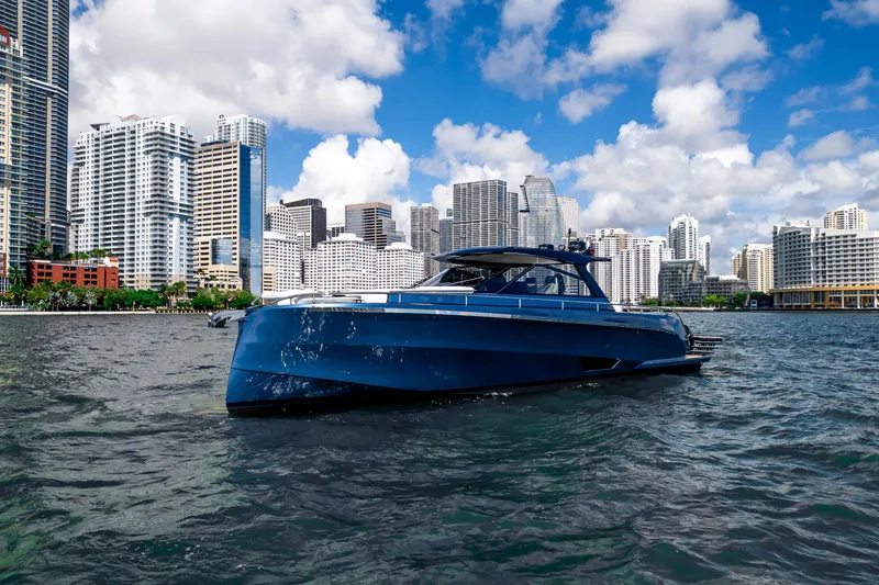 Slide: The Image of Luxurious 2025 Dutch American DA 53 yacht on serene lake with elegant waterfront homes. - 6