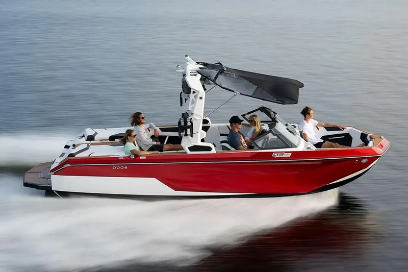 Slide: The Image of Manufacturer Provided Image: 2024 Nautique Super Air Nautique GS22 in red, cruising on water with passengers. - 21
