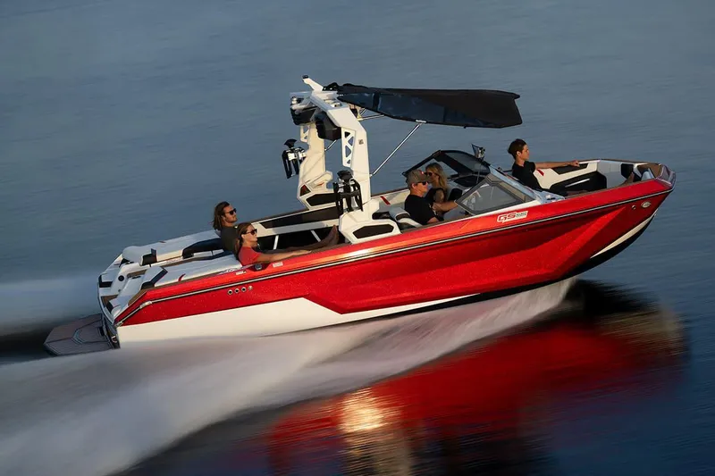 Slide: The Image of Manufacturer Provided Image: 2024 Nautique Super Air Nautique GS22 boat cruising on water with passengers. - 28