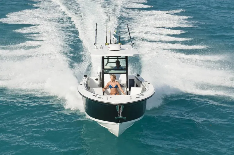 Slide: The Image of Manufacturer Provided Image: 2026 Blackfin 272 CC boat cruising on clear blue water, featuring sleek design and powerful performance. - 2