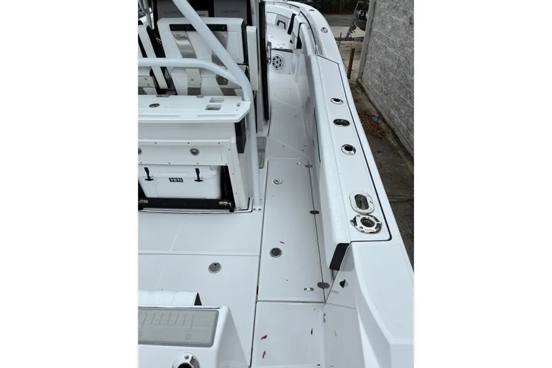 Slide: The Image of 2026 Blackfin 272 CC boat interior with seating and storage compartments. - 27