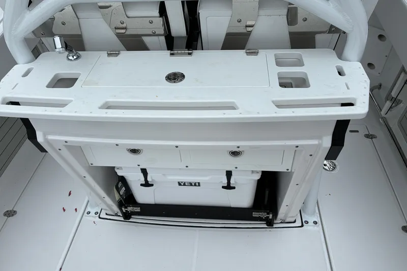 Slide: The Image of 2026 Blackfin 272 CC boat interior with Yeti cooler and storage compartments. - 30