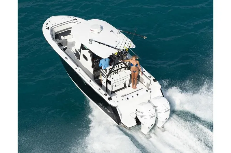 Slide: The Image of Manufacturer Provided Image: 2026 Blackfin 272 CC boat cruising on blue ocean waters. - 4