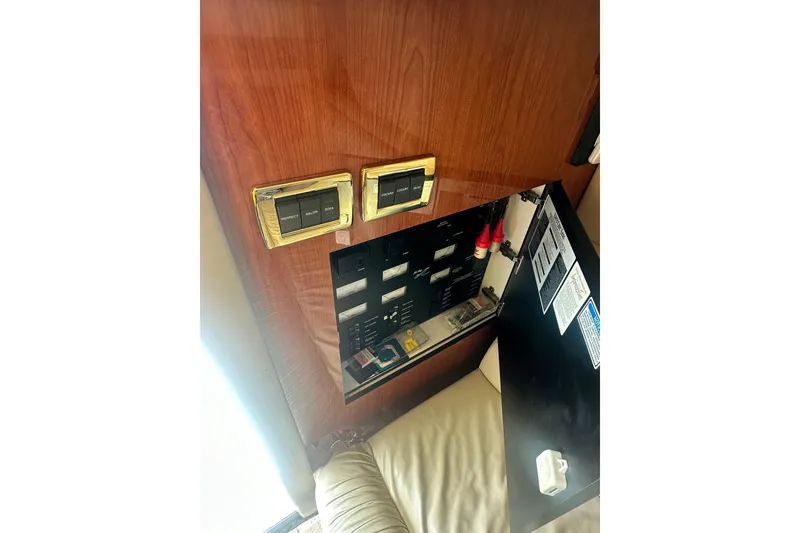 Slide: The Image of Electrical panel inside 2001 Sea Ray 400 Sedan Bridge yacht cabin. - 20