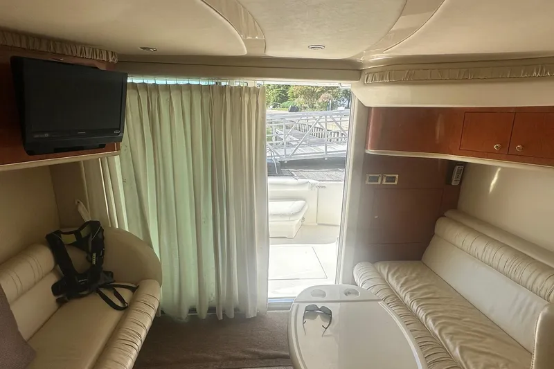 Slide: The Image of Interior of 2001 Sea Ray 400 Sedan Bridge yacht with seating and TV. - 45