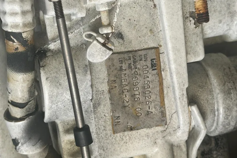 Slide: The Image of Close-up of engine component with serial number on a 2001 Sea Ray 400 Sedan Bridge. - 47