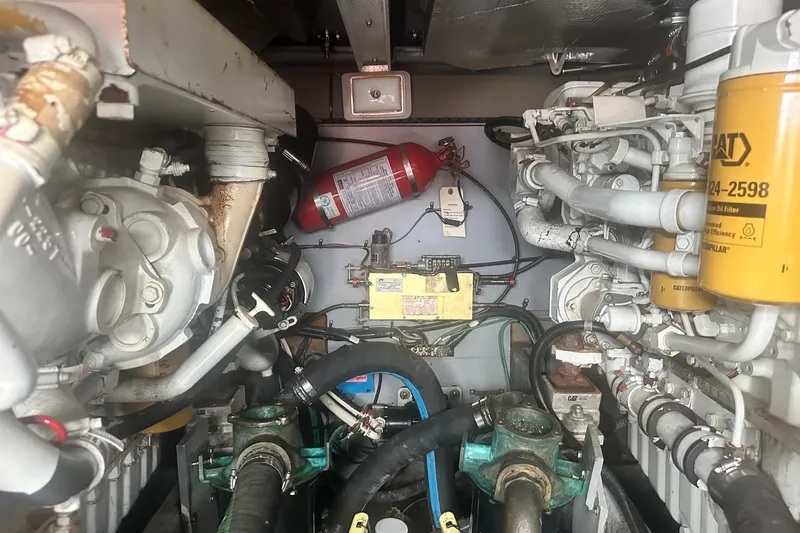 Slide: The Image of Engine room of 2001 Sea Ray 400 Sedan Bridge with visible components and fire extinguisher. - 50