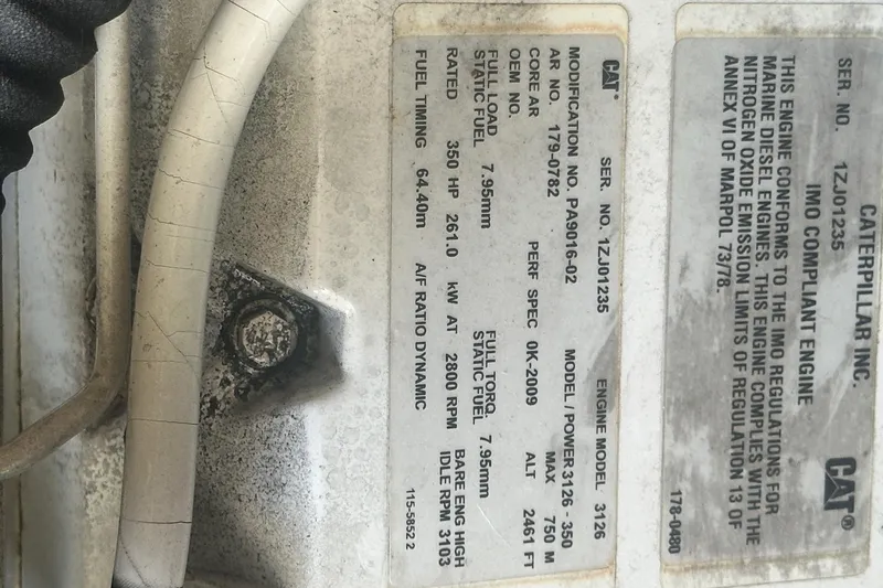 Slide: The Image of Engine specifications label on a 2001 Sea Ray 400 Sedan Bridge. - 53