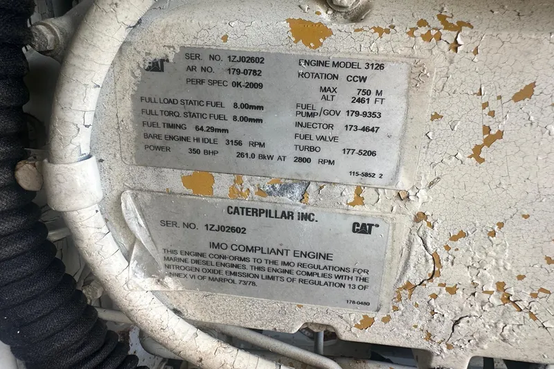 Slide: The Image of Caterpillar engine specifications on a 2001 Sea Ray 400 Sedan Bridge yacht. - 57