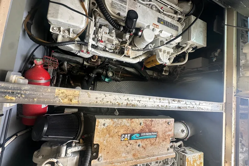 Slide: The Image of Engine room of 2001 Sea Ray 400 Sedan Bridge with Caterpillar marine engine. - 59