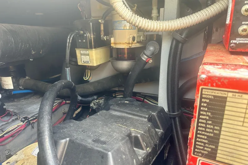 Slide: The Image of Engine compartment of 2001 Sea Ray 400 Sedan Bridge with visible components and wiring. - 61