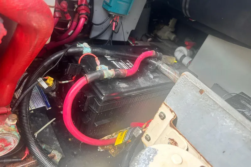 Slide: The Image of Battery compartment of a 2001 Sea Ray 400 Sedan Bridge with visible cables and connections. - 62