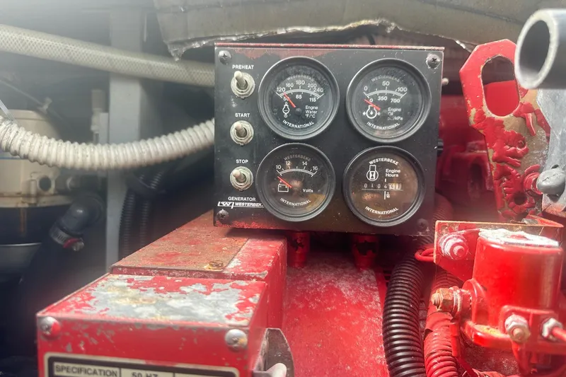 Slide: The Image of Engine control panel of a 2001 Sea Ray 400 Sedan Bridge boat. - 63