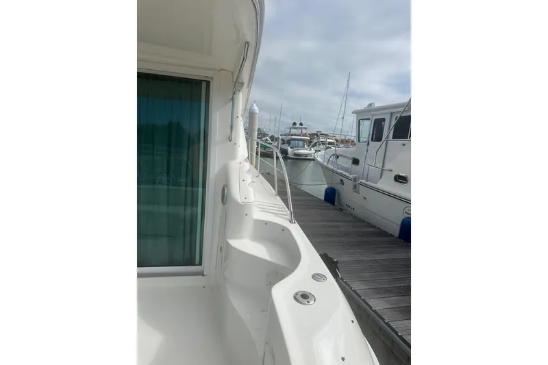 Slide: The Image of 2001 Sea Ray 400 Sedan Bridge docked at marina, side view. - 9
