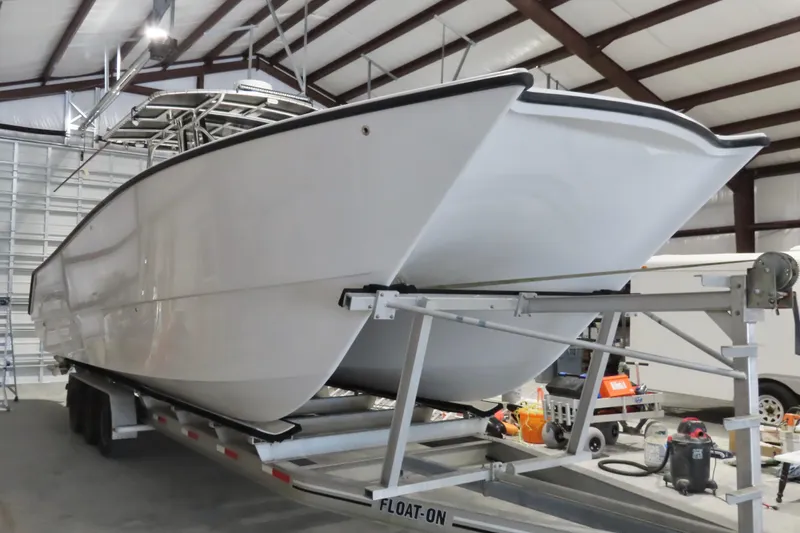 Slide: The Image of 2013 Freeman 33 boat on trailer in indoor storage facility. - 14