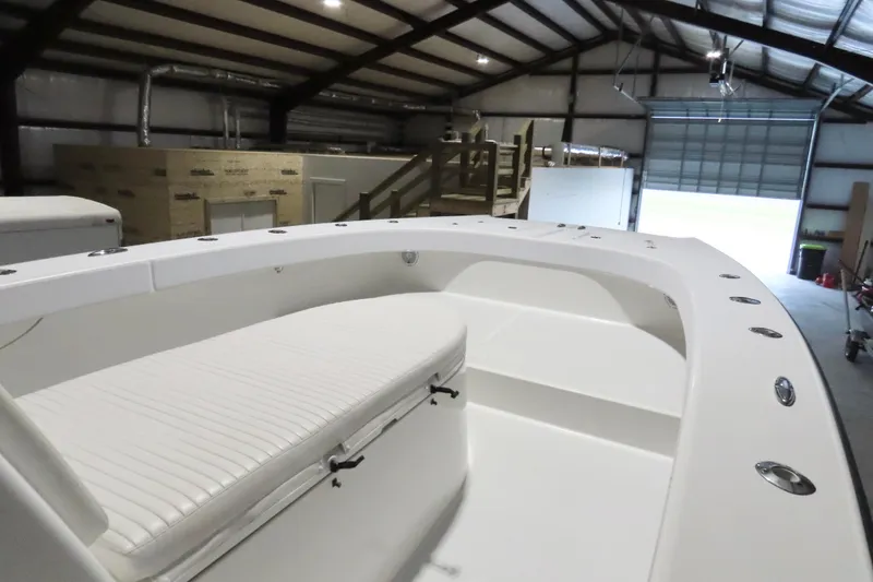 Slide: The Image of 2013 Freeman 33 boat interior in a spacious garage setting. - 18