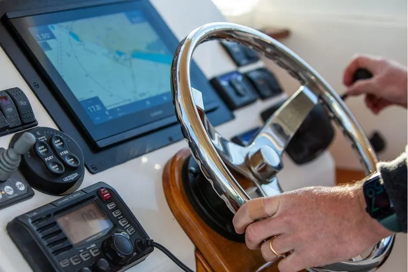 Slide: The Image of Steering wheel and controls of a 2007 Hunt Surfhunter 29 boat cockpit. - 30